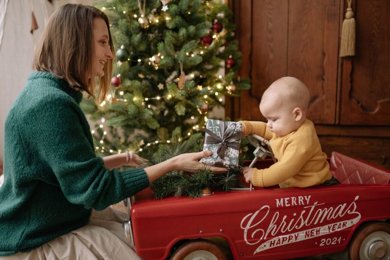 A Mother Giving a Present to a Baby